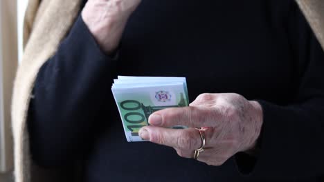 retired old woman counting money