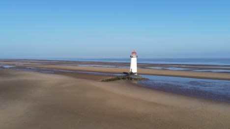 talacre red top dome lighthouse golden sandy low tide beach sunrise aerial pull back view