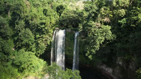 aerial flight reveals the beautiful misol-ha waterfall in mexico