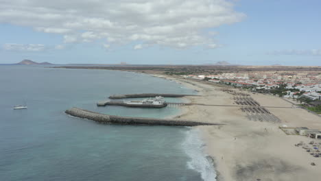 bikini beach club in coastal town of santa maria in cape verde, west africa. drone approach