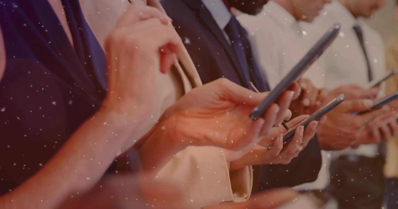Group of Business Professionals Using Smartphones in Office