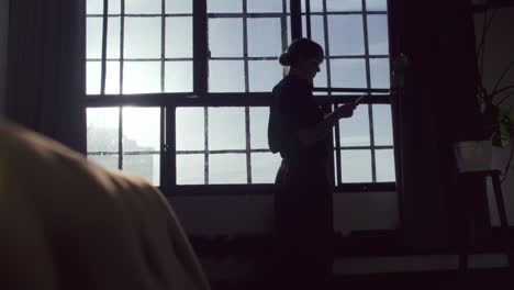 woman reading by the window