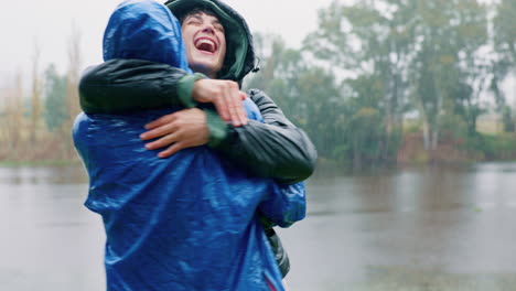 Camping,-love-and-a-couple-hugging-in-the-rain