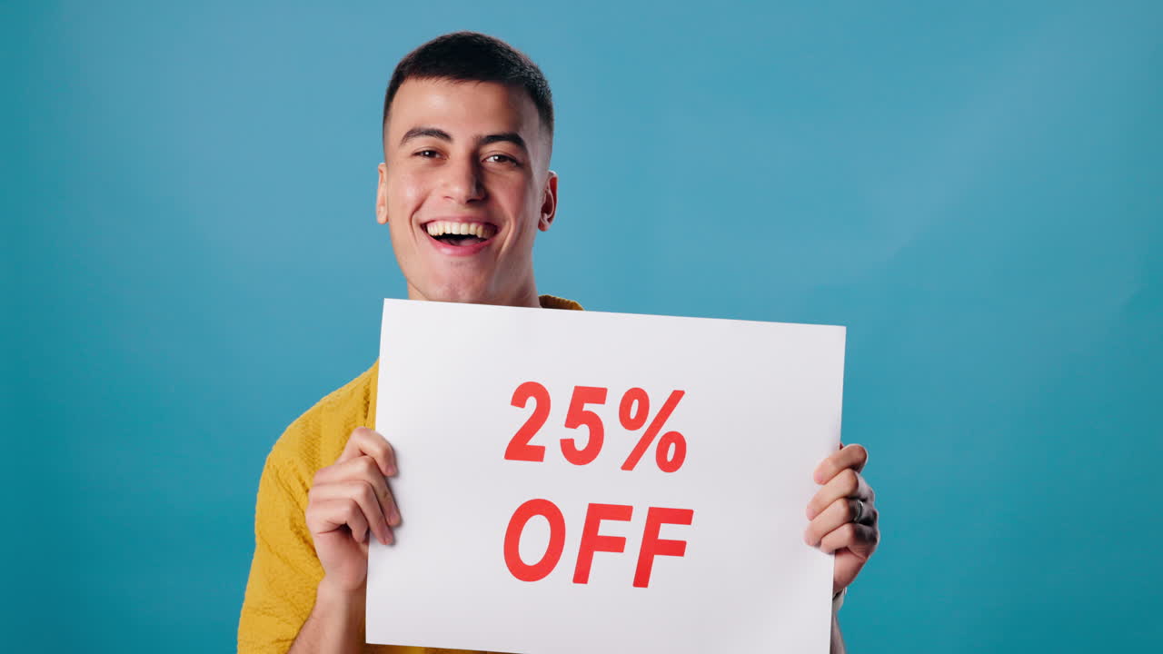 Man holding 25% off sign
