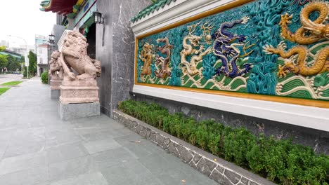 a walk towards an ornate chinese temple entrance.