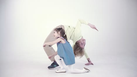 mother and daughter doing yoga pose