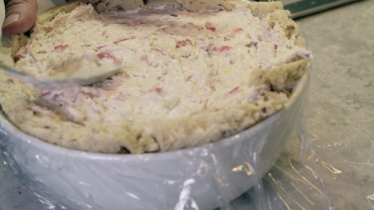 Making a Tuna Salad Bread Bowl