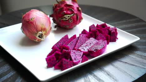 red dragon fruit slices on white plate juicy sweet and cultivating exotic plants pitaya