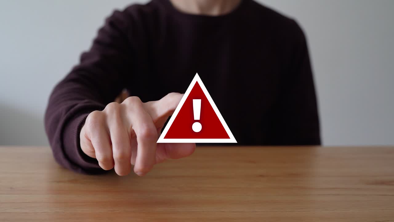 Guy Touch The Red Warning Sign Over The Table. - closeup shot