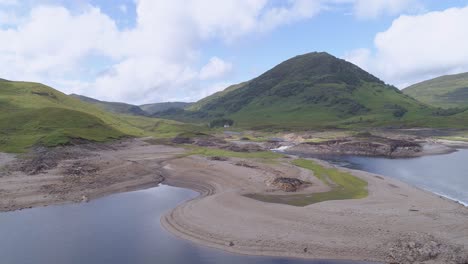 right to left aerial shot above loch treig, rannoch moor, looking southwards