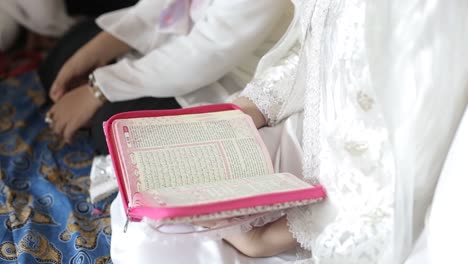 muslim girl who reads a holy islamic book or quran in the month of ramadan