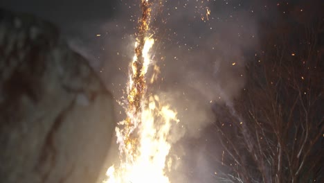 flaming bamboo pillar at hachiman matsuri festival, shiga japan