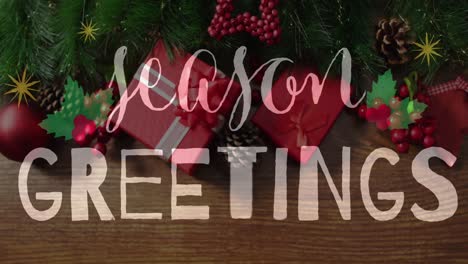 Animation-of-seasons-greetings-text-over-christmas-tree