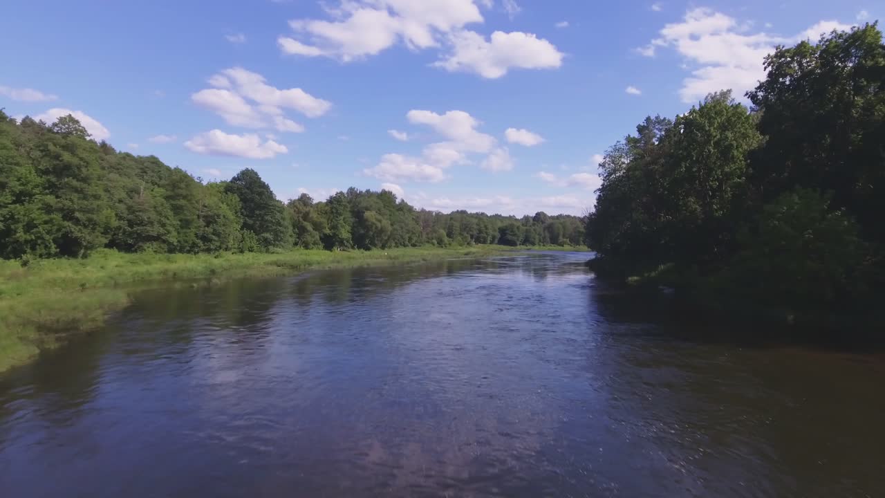 Winding Neris River on a Sunny Summer Day. Aerial Flying Low Forward
