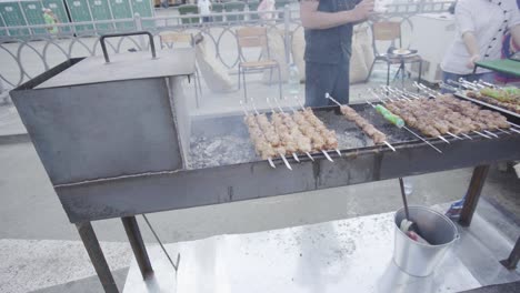 street food vendor cooking shish kebab