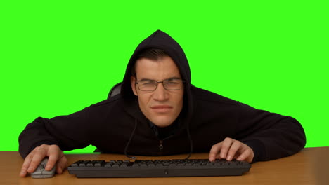 hacker typing at his desk