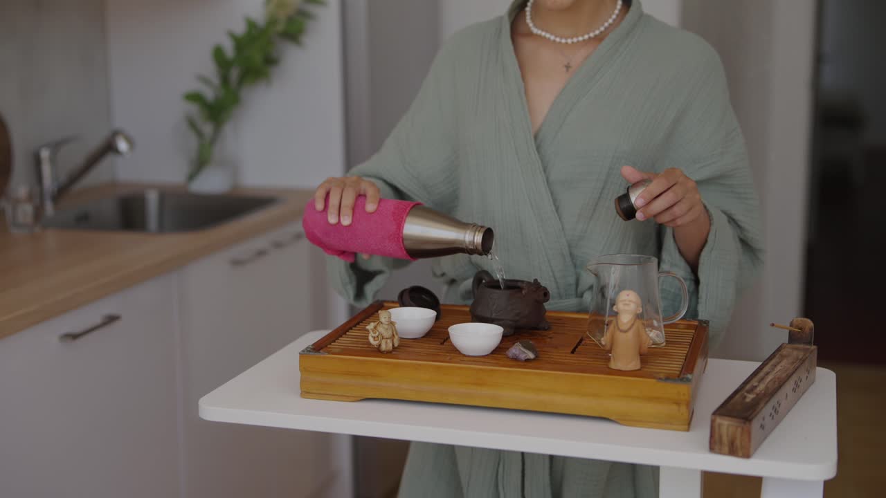 Woman preparing tea in the kitchen