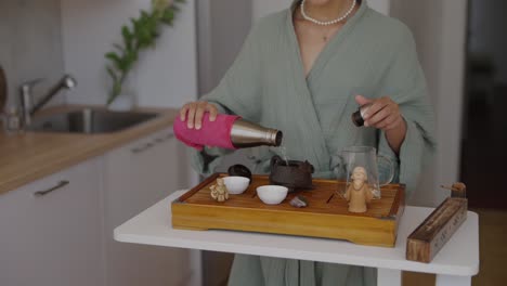 woman preparing tea in the kitchen