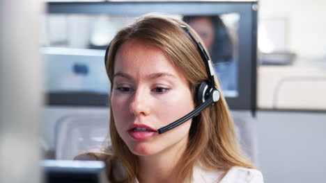 Young-white-woman-working-in-a-customer-service-call-centre