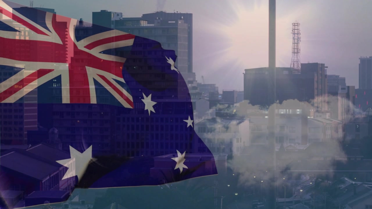 Comienza una brisa por la izquierda, la bandera australiana ondea y se voltea, revelando el horizonte y evocando patriotismo.