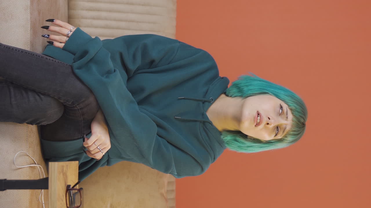Vertical video of Unhappy thinking young woman.