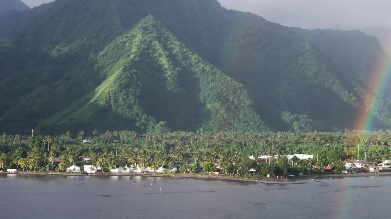 Tropical Island Town Of Teahupoʻo With Forest Mountain Backdrop In Tahiti, French Polynesia, France. Aerial Drone Shot