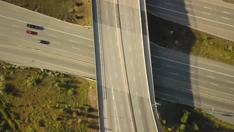 Birds-eye-view-of-highway-overpass-during-sunset