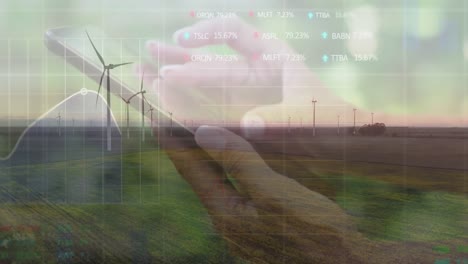 animation of financial data processing over caucasian woman using smartphone and wind turbine