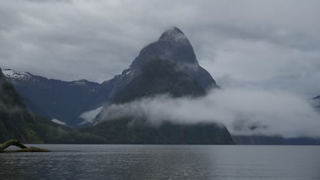 Mitre-Peak-with-clouds-on-moody-day-in-Milford-Sound,-timelapse