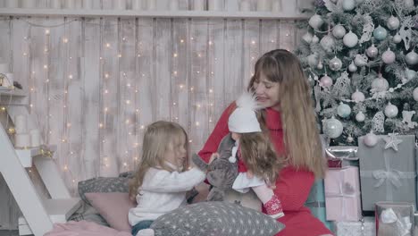 adored-little-girl-plays-dolls-with-pretty-blonde-mother