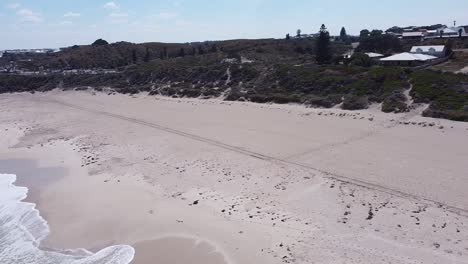 The-green-foliage,-white-sands-and-waves-of-Yanchep-lagoon-north-of-Perth