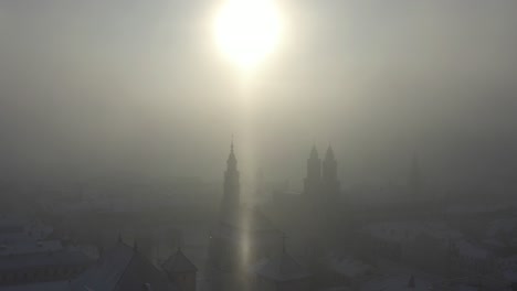 cold winter sunrise in kaunas old town. snow and sun. lithuania