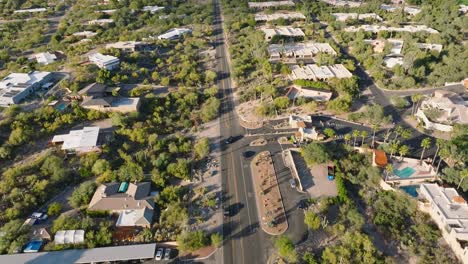 Aerial-Shot-of-Catalina-Foothills-in-Tucson-Arizona,-Houses-Below-with-Mountain-Range-Up-Ahead