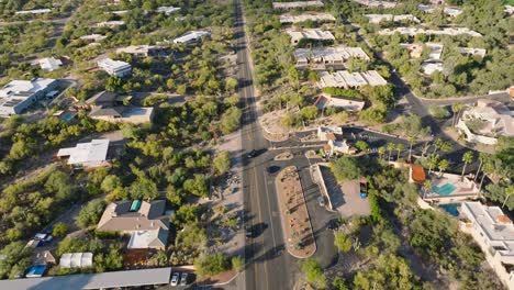 aerial shot of catalina foothills in tucson arizona, houses below with mountain range up ahead