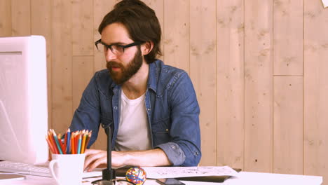 casual worker using computer at desk