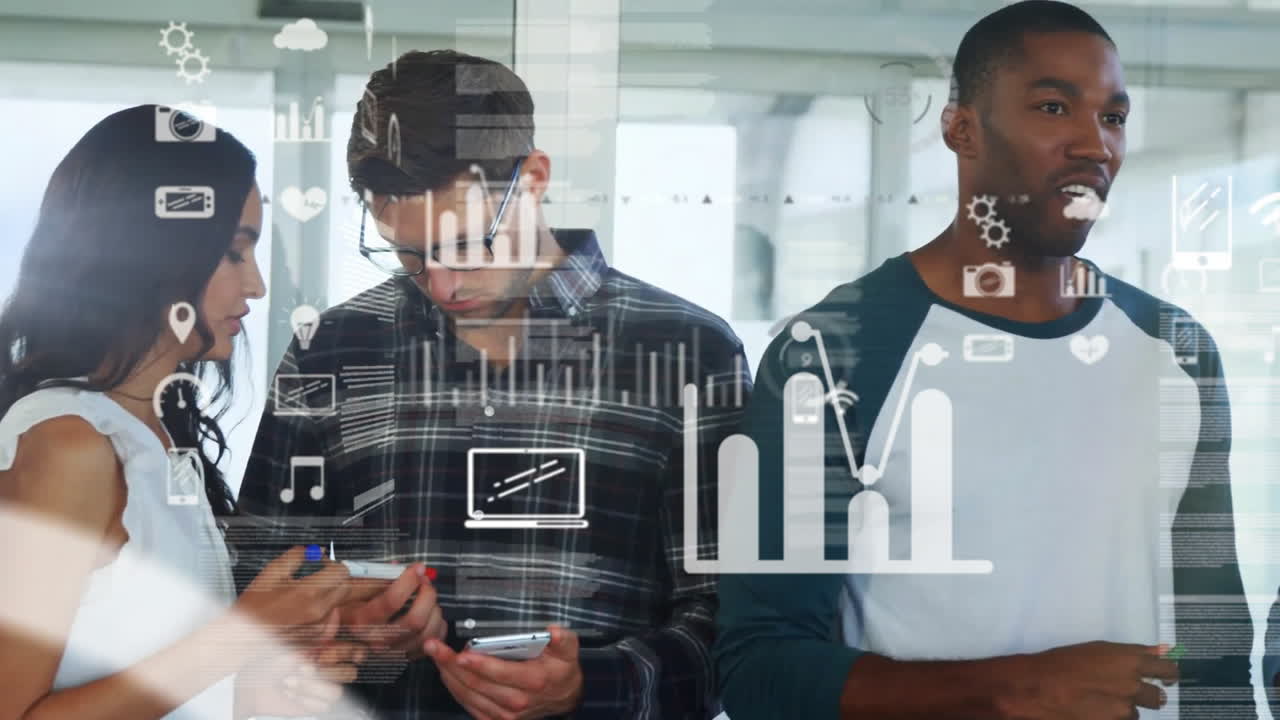 Animation of computer icons over multiracial colleagues sharing business ideas in office