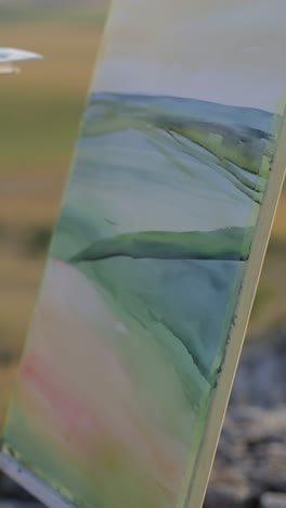 at sunlight young artist painting with oil paint picture on canvas hold brush and palette in light at sunlight young artist painting with oil paint picture on canvas hold brush and palette in light art studio workspace creative