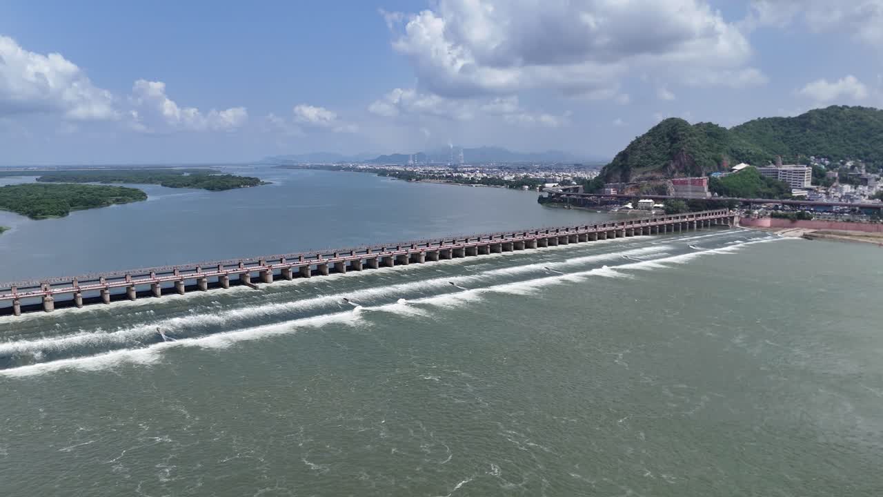 Aerial Drone Shot of Krishna River Dam in Vijayawada with Mountain Nearby
