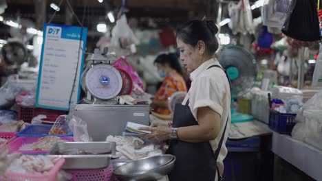 woman working at a fish market