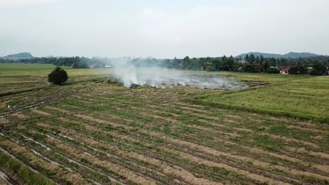 Fly-towards-open-burning-field-at-Malaysia,-Southeast-Asia.