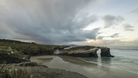 Arched-cliff-near-waving-sea