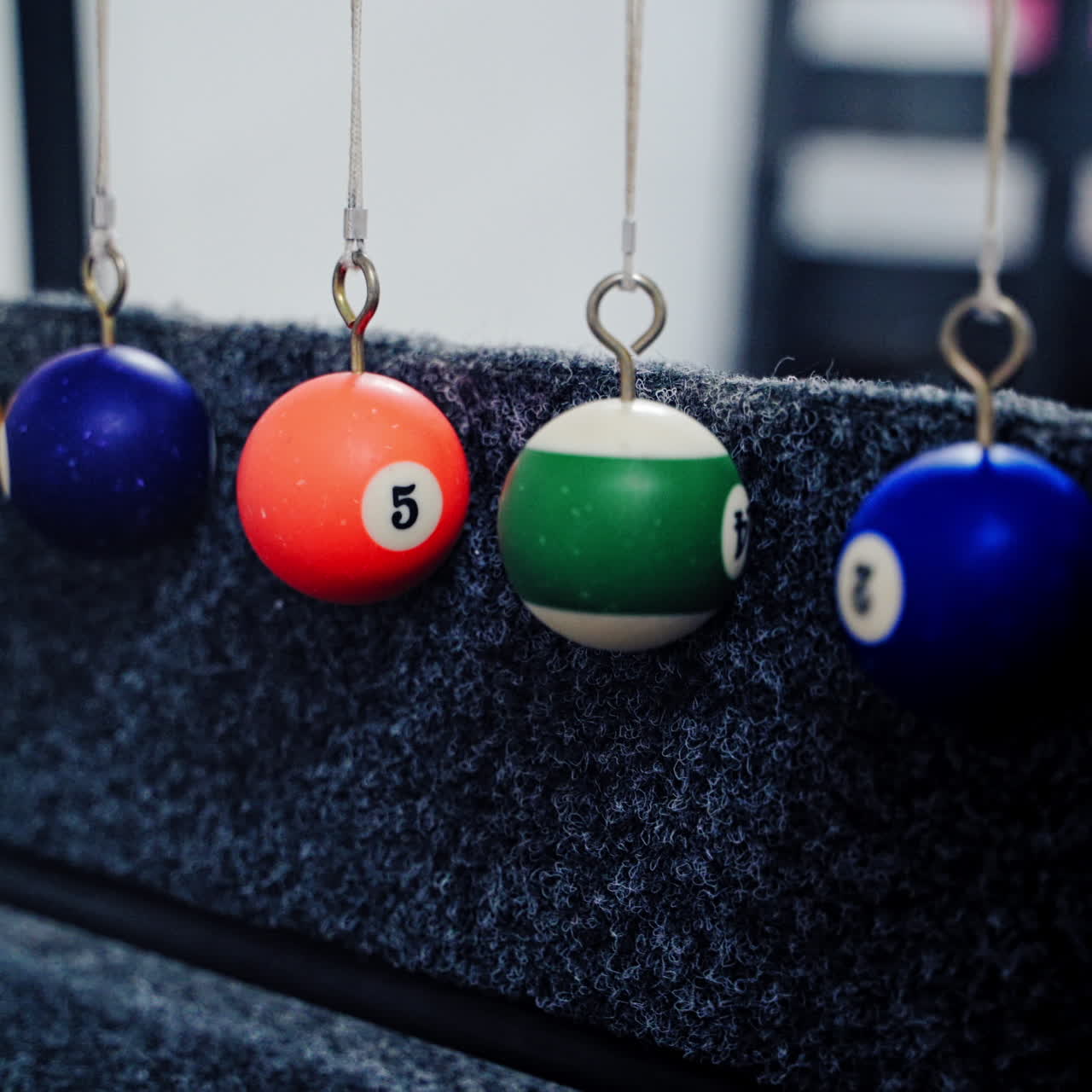 Newton's cradle showing laws of physics in motion. Museum of Science