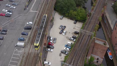 drone shot tracking train travelling through castlefield canals 05