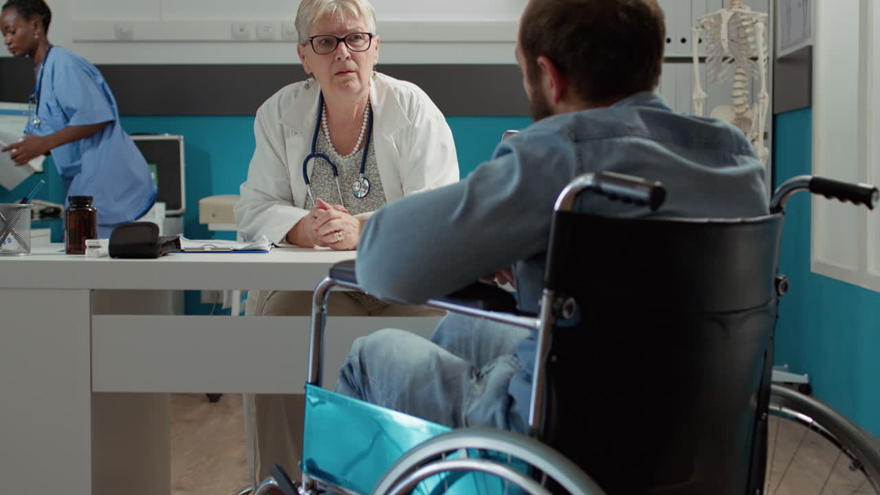 Doctor consulting wheelchair user in disability friendly office
