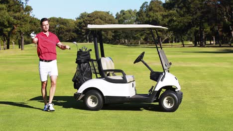 male golfer removing golf club from golf bag