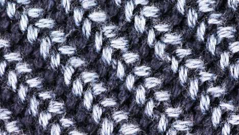 detail of textured pattern of woven wool material in handmade design - close up, orbit