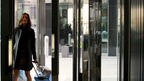 Beautiful-caucasian-businesswoman-entering-in-a-modern-hotel-4k