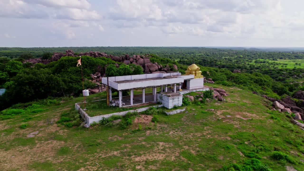Sri rama Temple with greenery, sky and clouds at yelupugonda village, Tekmal, telangana, india. day time, semi orbit, drone shot, 4k.