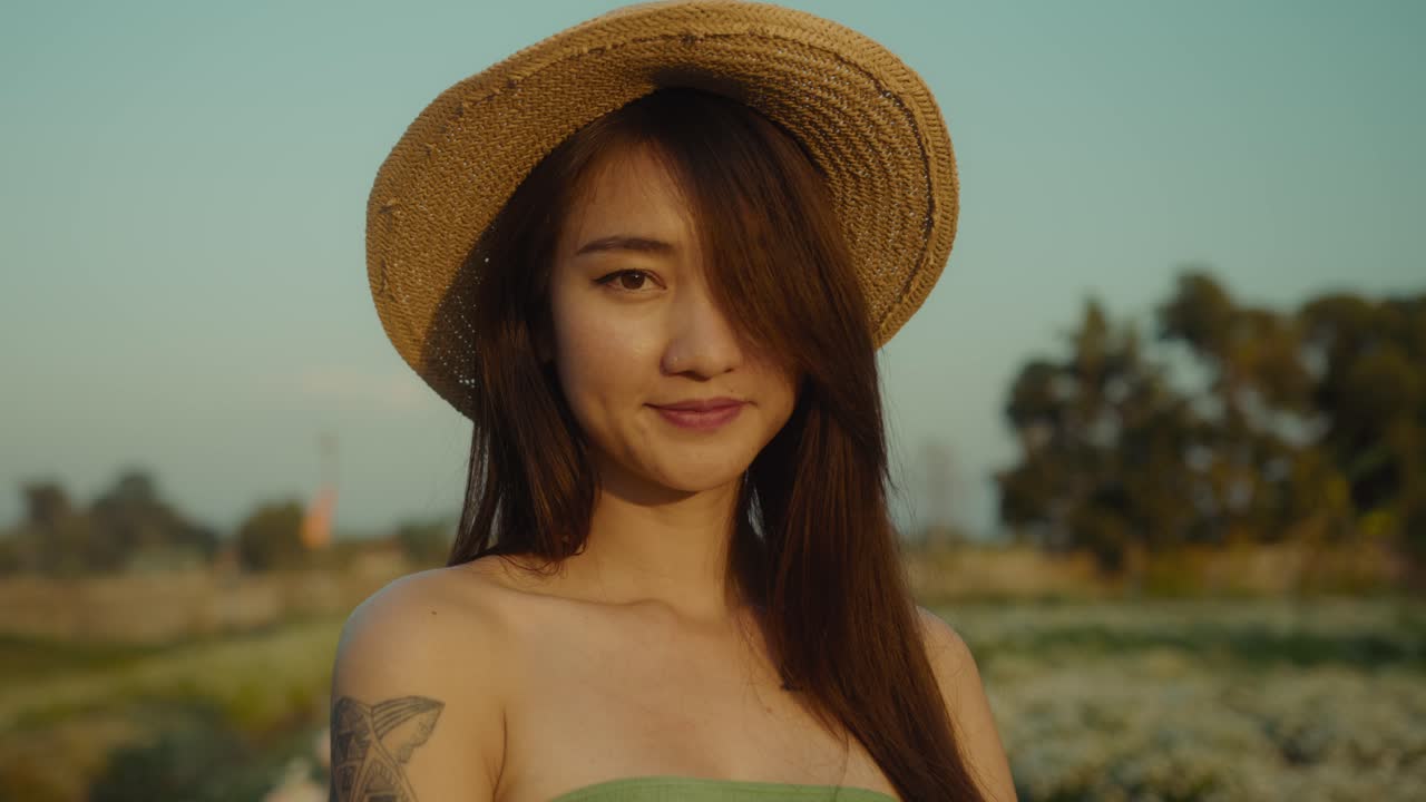 Woman in a Straw Hat in a Field