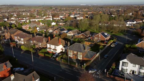aerial view expensive british middle class houses in autumn rural suburban neighbourhood